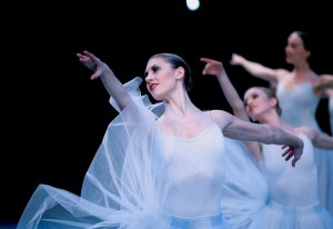 Pacific Northwest Ballet corps de ballet dancer Jessika Anspach with company dancers in Serenade, choreography by George Balanchine © The George Balanchine Trust. Photo © Angela Sterling.